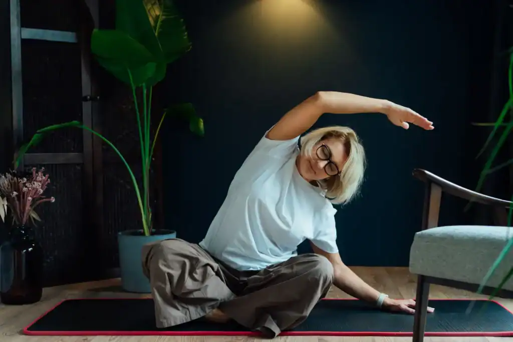 middle-aged-woman-sitting-on-floor-mat